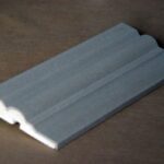 Exterior moulding profiles featuring advanced EPS construction with intricate detailing accentuated by a robust cement-synthetic finish, reflecting a harmonious blend of historic craftsmanship and modern durability.
